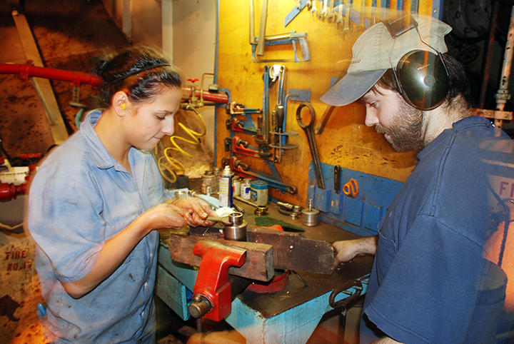 Crew members working in engine department