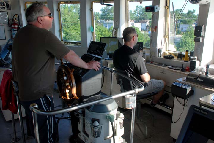 Captain in pilothouse on Maritime Trader