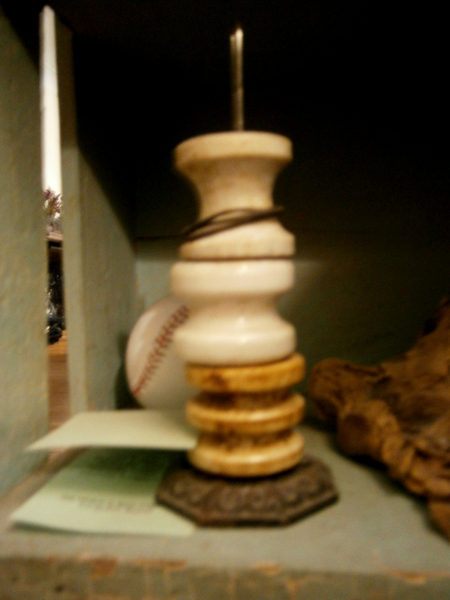these old ceramic insulators were pulled from the basement joists of my house years ago and live on an old metal paper spindle