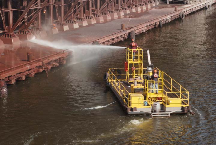 CN crew cleaning dock facing