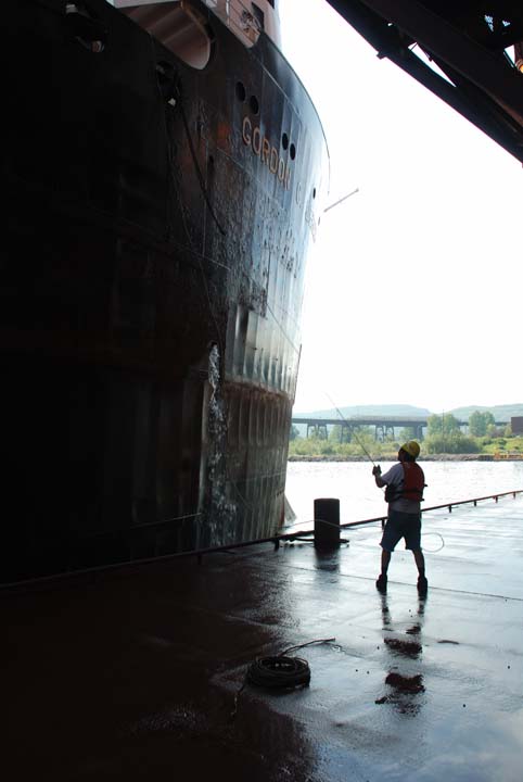 Deckhand grabbing heaving line